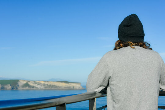 Man admiring the beaches of Cantabria in Spain