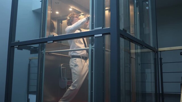Happy office worker celebrates success dancing with documents in workplace feeling excitement after productive day expressing joy achievement and positive energy from finished task