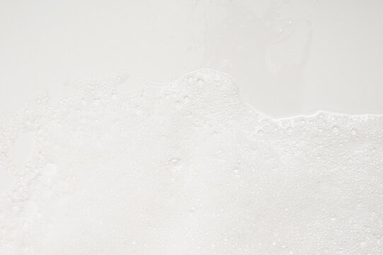 Close-up of white foam and bubbles on a clean surface