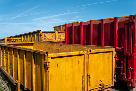 Yellow and red industrial skip bins for waste recycling