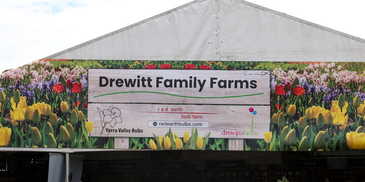 Perth, Western Australia, Australia - April 19 2026: Drewitt Family Farms, Yarra Valley Bulbs, red earth bulb farm, sign, market store front, with flowers in foreground. Bulbs and perennial flowers