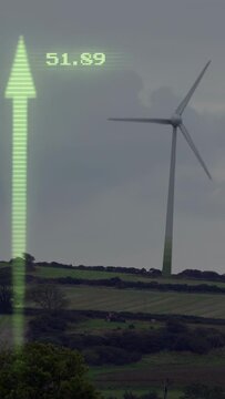 Vertical video: Wind turbine rotating while green AR overlay growing on data update, showing output