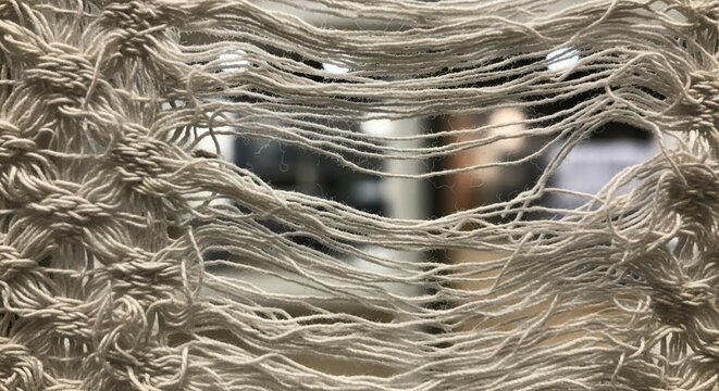 Frayed white cotton macrame texture