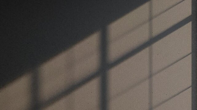 Animated Dramatic Window Shadow Movement on Dark Grey Wall