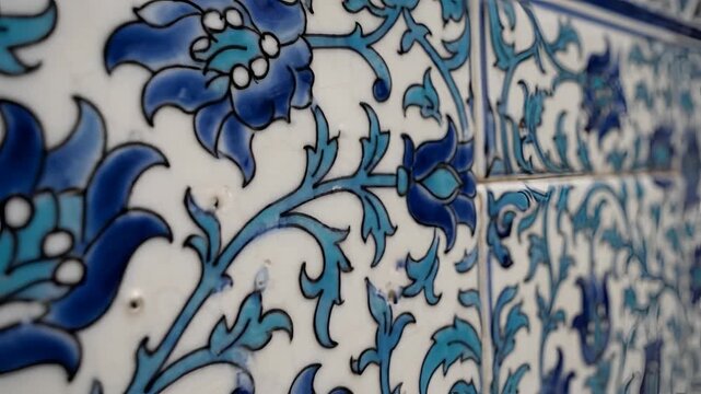Closeup of intricate blue and teal floral tile pattern.