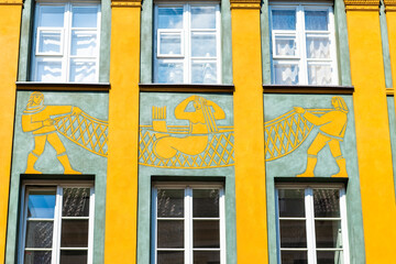 Mermaid of Warsaw, Poland syrenka warszawska symbol coat of arms ornate carving on building exterior, myth legend in old town market square © Andriy Blokhin