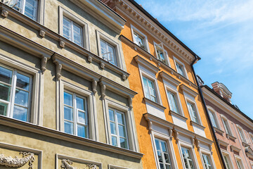 Warsaw, Poland ornate carving on colorful multicolored building exterior in old town of nowe miasto street © Andriy Blokhin