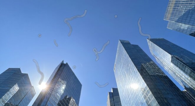 POV of eye floaters against city skyscrapers and blue sky