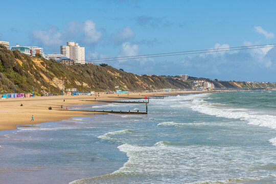 East Cliff Beach, Bournemouth, UK - April 12th 2026: Wooden groynes on the sandy beach.