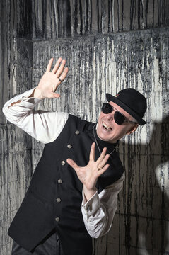 Screaming vampire man against textured grunge background