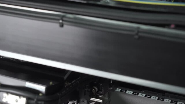 Robotic production of printed circuit board. Automated manufacturing of electronic chips. Close-up of a part of the production line in the process of manufacturing microchips.