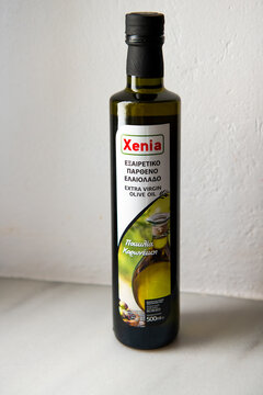Karavostamo, Ikaria Island Greece - May 12, 2023: Xenia extra virgin olive oil, cold pressed Greek food healthy fat in glass bottle from grocery store