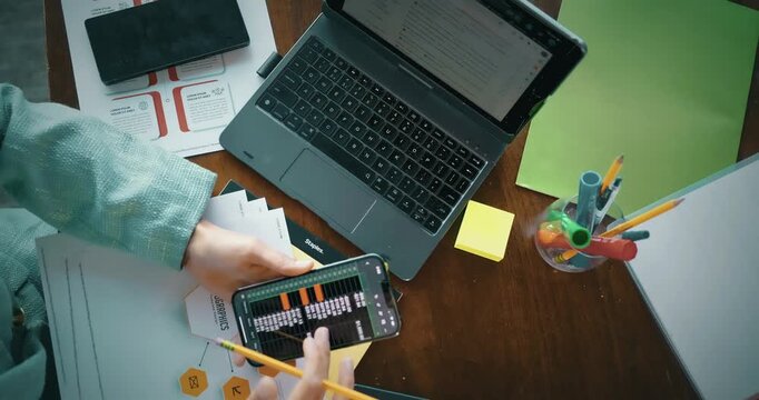 Business Analysis with Phone and Laptop Workspace