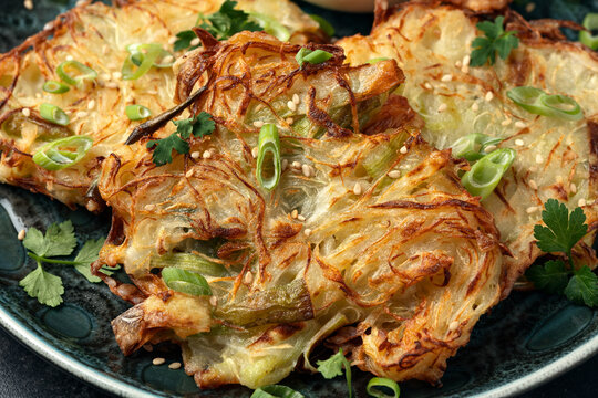 Korean cabbage pancake with vegetables and soy sauce. Asian food style