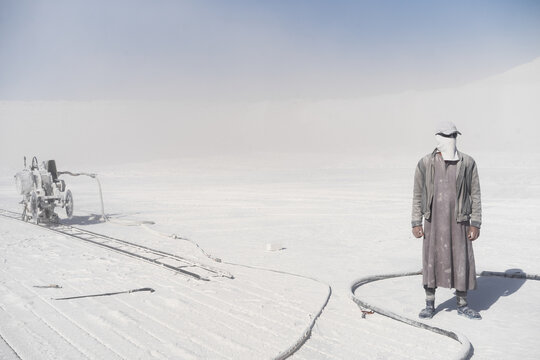 Portrait of a limestone quarry worker with the cutting machine.  Menya Egypt