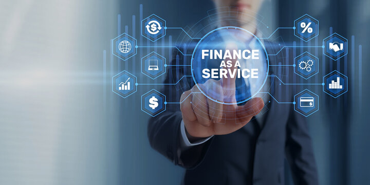 Finance as a Service concept with businessman touching virtual financial interface and connected digital network icons
