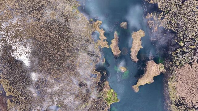 A bird's-eye view of the Karakuyu Marshes: The clouds above the water and the texture of the marshes create a mesmerizing landscape, like a unique abstract painting offered by nature.