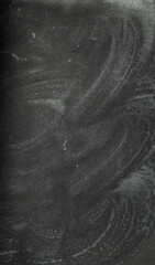 Fototapeta premium texture of blurred chalk residue on black paper, creating a soft, dusty, and artistic background with subtle gradients and organic patterns.
