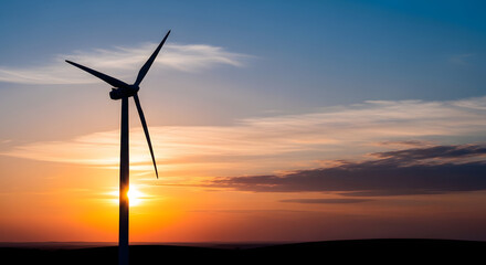 Fototapeta premium silhouette of wind turbine at sunset