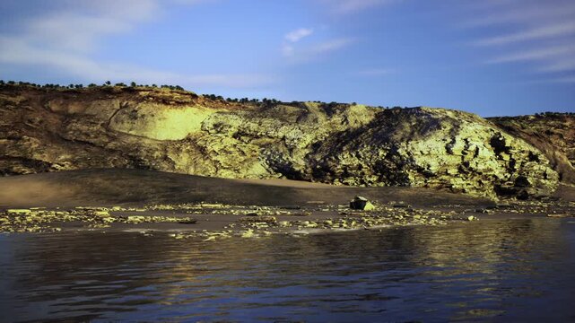 Limestone cliff with detailed sediment layers observed. Sunshine bathes rough limestone formation as scientist examines sedimentary layers beneath calm sea