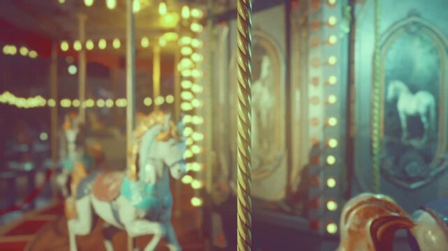 Soft motion carousel horses with warm glow and painterly blur, vertical pole in foreground adds depth evocative motion and light combine to suggest fleeting