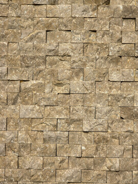 Seamless natural beige split face stone mosaic tile texture