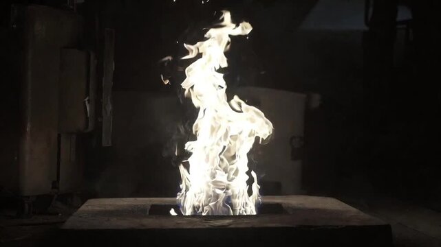  `Magnesium ribbon burning with intense white flame on dark background