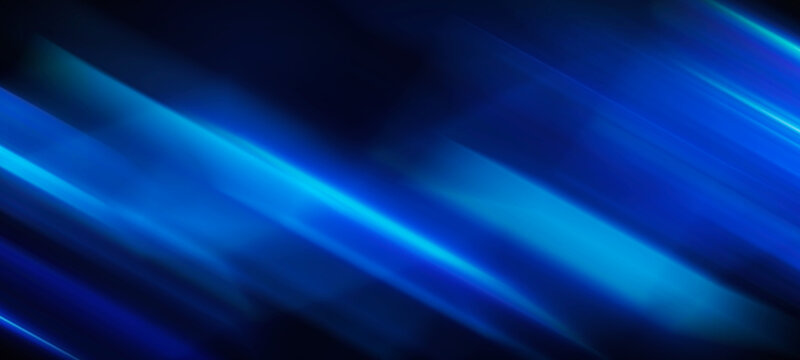 Abstract blue background with diagonal light streaks, smooth gradient, vibrant energy, motion blur effect.