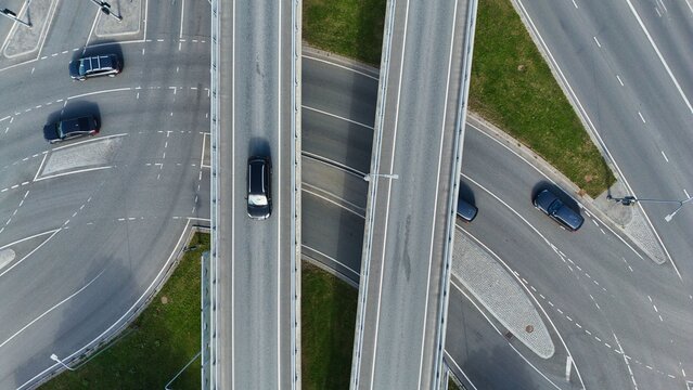 Drone Top Down View of Modern Highway Overpass and Urban Road Infrastructure