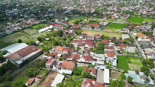 Stunning overhead panorama of Mataram capital featuring Tembolok Gate highway intersection mosques and Mount Rinjani backdrop