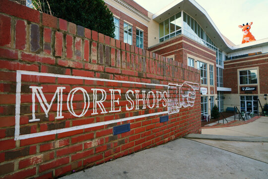 Holly Spings, NC - USA - 12-24-2025: Shops and restaurants on in downtown Holly Springs , decorated for the Christmas holidays