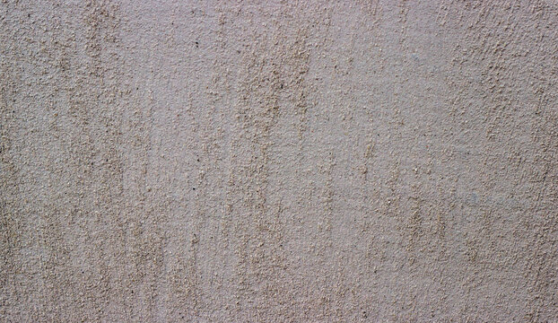 Gray textured wall background. Rough plaster surface