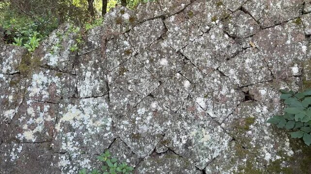 Ancient Wall of Layered Tufa Stones in Cerveteri Necropolis