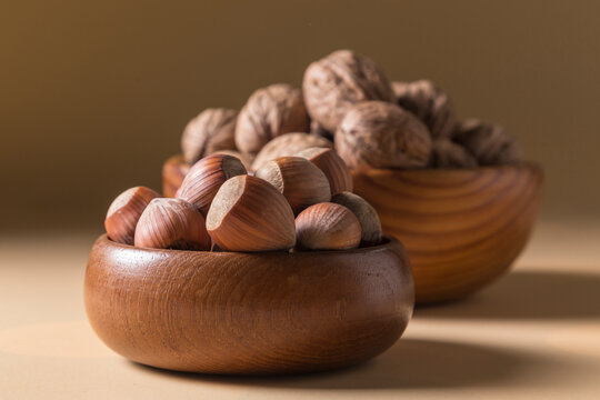 Hazelnuts and Walnuts in Wooden Bowls Landscape