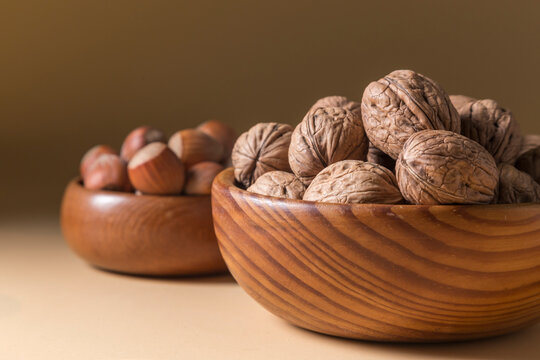 Walnuts and Hazelnuts in Wooden Bowls