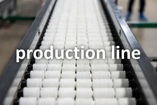 Subject: A production line with rollers. Action: Items are moving along the conveyor belt. Setting: An industrial factory environment.