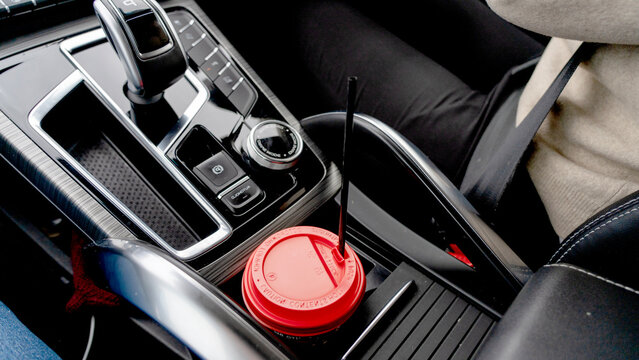 Red lid sits in car's center console