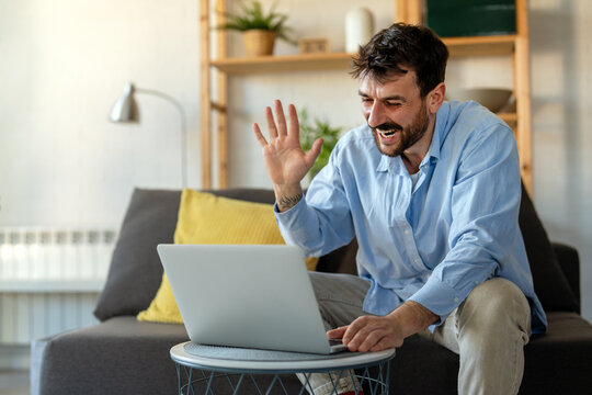 Man working remotely from home office, having an online meeting, enjoying flexible freelance work