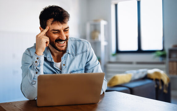 Young man attending an online course from home, learning new skills through virtual education