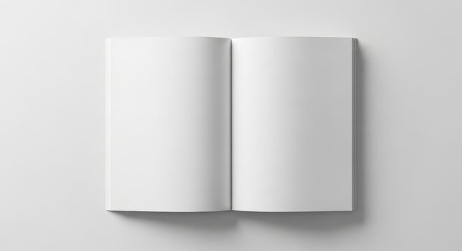 Open blank book with white pages spread flat on a plain light gray studio background