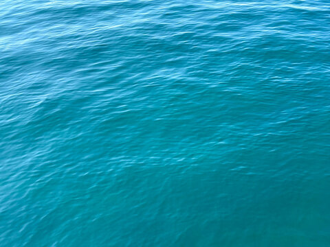 Blue sea calm water background.