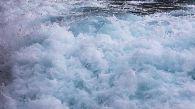 Speedboat wake churning water in super slow motion