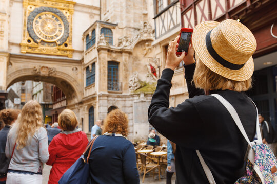 Traveler girl in Rouen city. Tourist woman near Gros-Horloge (Great-Clock) in Rouen, Normandy, France