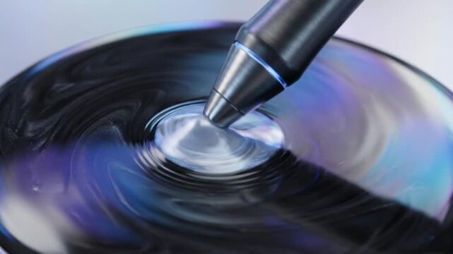 Captivating pen ink flow creating ripples studio setting close-up photography fluid dynamics top-down perspective artistic expression