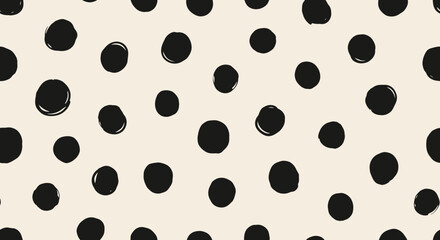 Obraz premium Black and white polka dot pattern on cream background