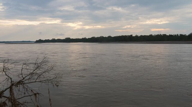 Rio Napo in the Ecuadorian Amazon at dusk. Rio Napo is a major tributary of the Amazon. At Pompeya Sur, Orellana province, Ecuador