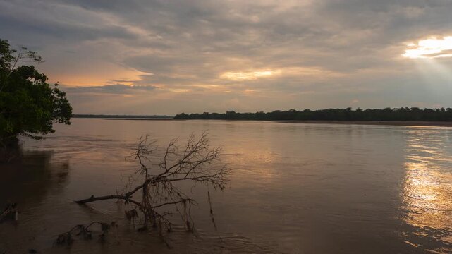 Rio Napo in the Ecuadorian Amazon, sunset timelapse. Rio Napo is a major tributary of the Amazon. At Pompeya Sur, Orellana province, Ecuador