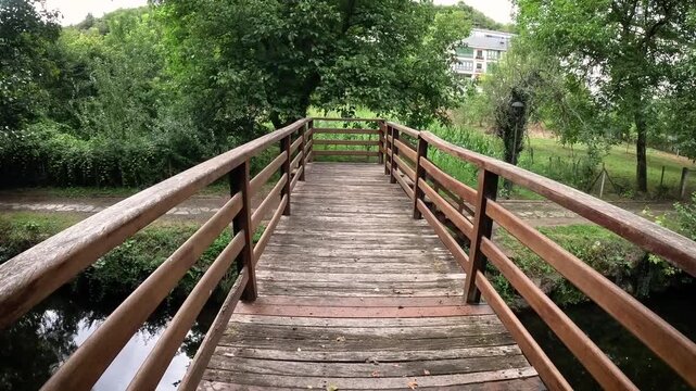 wooden bridge over Sarria river in Samos, comarca of Sarria, province of Lugo, Galicia, Spain