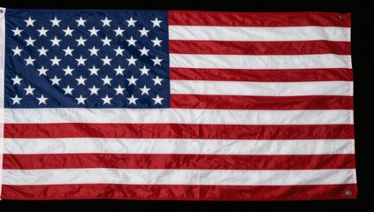 Obraz premium Detailed shot of an american flag showing stars and stripes on a black background