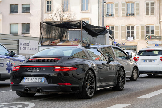Nancy, France - April 11th 2022 : View on a black Porsche 991 Targa 4S MkII driving on a street in the middle of traffic.